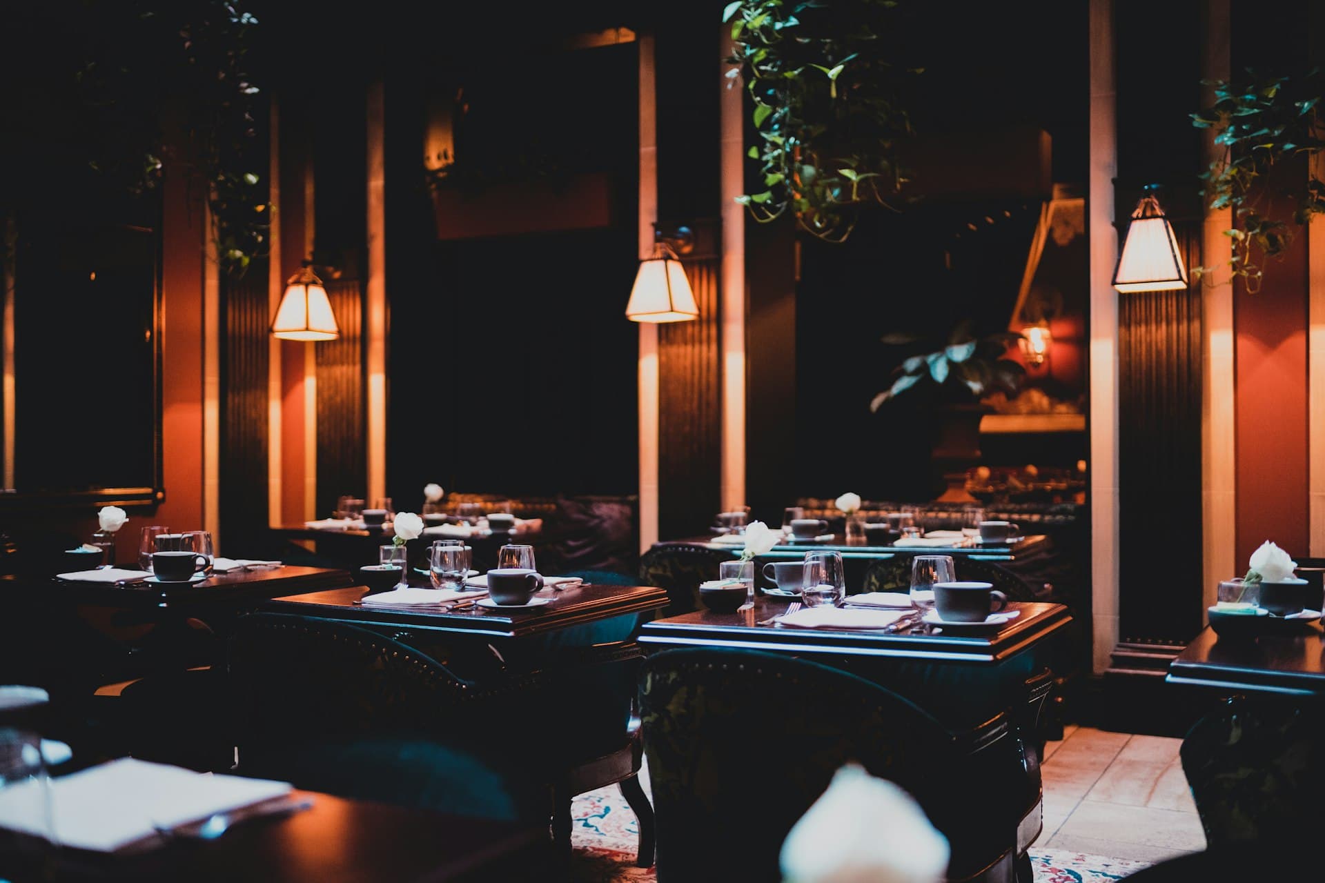 A quiet corner booth in a warm, softly lit restaurant